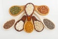 Wooden spoons with assorted grains of super foods, gluten free