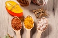 Wooden spoons with brown, yellow and white sea salt and handmade Royalty Free Stock Photo