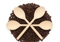 Wooden spoons in coffee beans Royalty Free Stock Photo