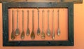 Wooden spoons hanging on a cutting board