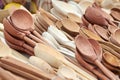 Wooden spoons made from different types of wood on the market counter