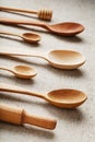 Wooden spoons made of natural wood on burlap fabric as a craft. Royalty Free Stock Photo