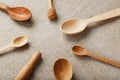 Wooden spoons made of natural wood on burlap fabric as a craft. Royalty Free Stock Photo