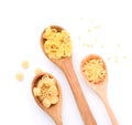 Wooden spoons with various uncooked pasta on white background Royalty Free Stock Photo