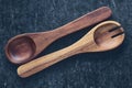 Wooden spoons in vintage style lie diagonally on a gray background. Kitchen utensils Royalty Free Stock Photo