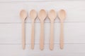 Wooden spoons on white boards