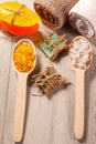 Wooden spoons with yellow and white sea salt and handmade soap f Royalty Free Stock Photo