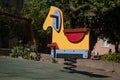 A wooden springing carousel very colorful in a quiet and lonely playground