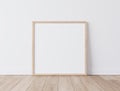 Wooden Square Frame Standing On Parquet Floor With White Background, Minimal Frame Mock Up Interior
