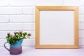 Wooden square picture frame mockup with pink clover