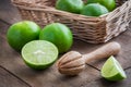 Wooden squeezer and lime on table Royalty Free Stock Photo