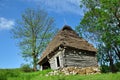 Wooden stable with thatched roof in the mountains Royalty Free Stock Photo