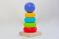 Wooden stacking toy. Development games for children. Colorful pyramid