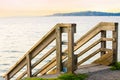Wooden stair rails leading down to water in Pacific Northwest