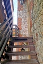 Wooden staircase along the wall of the old building. Royalty Free Stock Photo