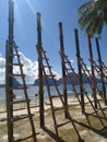 Wooden staircase on the beach, Philippines. Wooden rustic stairs on sand beach. Landscape of island village.