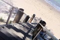 Wooden staircase descends down to the sandy sea beach in the morning Royalty Free Stock Photo