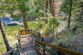 Wooden staircase going down to the shoreline of Stanislau River, Calaveras Big Trees State Park, California Royalty Free Stock Photo