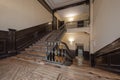 Wooden staircase with metal railing and wooden handrails in an old residential building in the center of Madrid Royalty Free Stock Photo