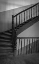 Wooden staircase in old building, monochrome. Retro wooden ladder in abandoned house, black and white. Vintage architecture. Royalty Free Stock Photo