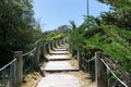 Wooden staircase path access to the beach  on a bright summer day in Isle de Noirmoutier in VendÃÂ©e France Royalty Free Stock Photo