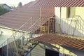 A wooden staircase with a railing leads to the second floor of a private residential building Royalty Free Stock Photo