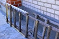 Wooden stairs against a brick wall in the village