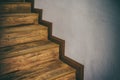 Wooden stairs climb up hardwood inside home