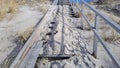 Wooden stairs covered by beach sand Royalty Free Stock Photo