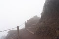 wooden stairs on a foggy day on the pedestrian path to the top of the mount vesuvio volcano.  Naples, Italy. Royalty Free Stock Photo