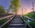 Wooden stairs in forest at sunset in spring. Plitvice Lakes Royalty Free Stock Photo
