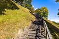 Wooden stairs going up on the hill and forest Royalty Free Stock Photo