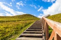 Wooden stairs going up to the historical mound of Seredzius, Lithuania Royalty Free Stock Photo