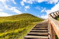 Wooden stairs going up to the historical mound of Seredzius, Lithuania Royalty Free Stock Photo
