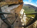 Wooden stairs at hiking trail along the cliff with beautiful mountain view of Wentworth Falls, New south wales, Australia. Royalty Free Stock Photo