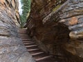 Wooden stairs leading through narrow gorge with colorful eroded rocks near Athabasca Falls in Jasper National Park, Canada. Royalty Free Stock Photo