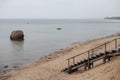 Wooden stairs leading to an empty beach Royalty Free Stock Photo