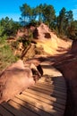 Wooden stairs leading to Le Sentier des Ocres in Roussillon in F Royalty Free Stock Photo