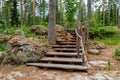 Wooden stairs on nature hiking trail in forest, Finland. Royalty Free Stock Photo