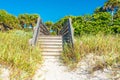 Wooden stairs over sand dune and grass at the beach in Florida USA Royalty Free Stock Photo