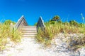 Wooden stairs over sand dune and grass at the beach in Florida USA Royalty Free Stock Photo