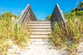 Wooden stairs over sand dune and grass at the beach in Florida USA Royalty Free Stock Photo
