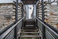 Wooden stairs with railing and wooden steps in a small alley with a sign in German with the text Ã¢â¬â no winter service - Germany