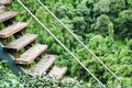 Wooden stairs in rural area with green forest in the background. Royalty Free Stock Photo