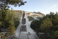 Wooden stairs to the beach covered with sand. Lubiatowo dunes, nature park with a protected coastal strip by Baltic sea Royalty Free Stock Photo