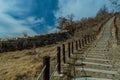 Wooden stairs up mountainside Royalty Free Stock Photo