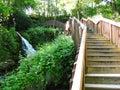 Wooden stairway near waterfalls Royalty Free Stock Photo