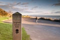 Wooden stake with England Coast Path sign on the promenade in Ramsgate with copy space