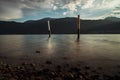 Wooden stakes in the water of the lake Royalty Free Stock Photo