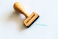 A wooden stamp marks the geman word Royalty Free Stock Photo